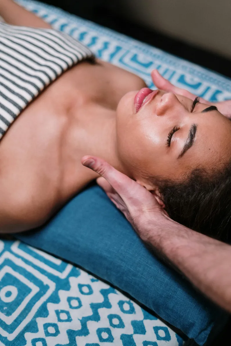 Massage therapist performing Swedish massage techniques