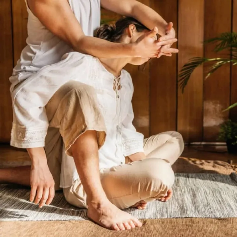 Thai yoga massage with assisted stretching techniques