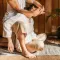 Thai massage therapist working on a client
